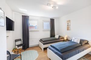 Ένα ή περισσότερα κρεβάτια σε δωμάτιο στο VAZ Apartments Walsum für Monteure und Fachkräfte, Küche, Terrasse, TV, WLAN, Parkplatz, Autobahnähe