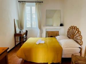 Ένα ή περισσότερα κρεβάτια σε δωμάτιο στο Maison centre village ZONZA