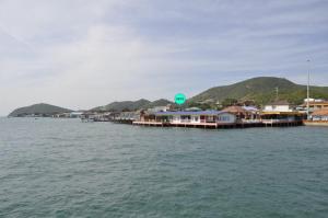 a group of houses on a dock in the water at Chill Days @ Koh Larn in Ko Larn