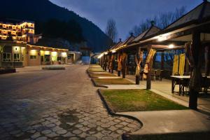 a cobblestone street in a town at night at Suvastu Resort Swat by Khan Familia Travels in Swat