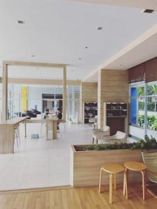a large room with tables and chairs in a building at Beautiful 1bedroom 35sqm sea view floor17th jomtien Lumpini in Jomtien Beach +49 photos