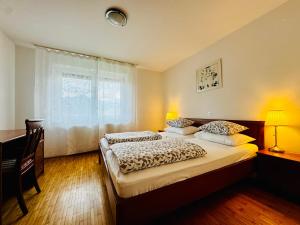 Postel nebo postele na pokoji v ubytování Villa Bohinj