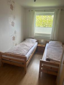 Postel nebo postele na pokoji v ubytování Ferienwohnung-West