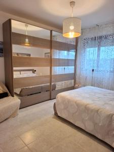 A bed or beds in a room at CASA del SOLE APARTMENTS with garden