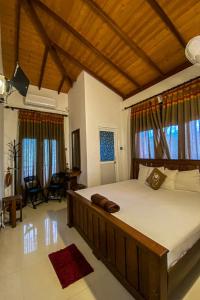 Postel nebo postele na pokoji v ubytování Harambathenna Resort Anuradhapura