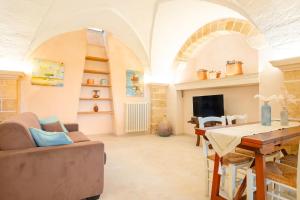 A television and/or entertainment centre at Villa Luritu Luxury Pool Tricase by HDSalento