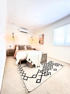 Giường trong phòng chung tại Spritz on Scarborough