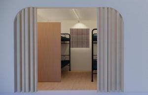 an open door to a room with bunk beds at Zen Seoul Stay in Seoul