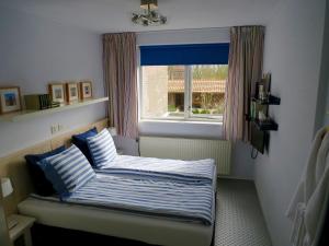 Postel nebo postele na pokoji v ubytování B&B Vloedlijn Texel