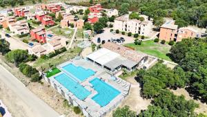 an aerial view of a house with a swimming pool at Corsica Bella 87 T2 Cosy piscines proche plage in Lecci