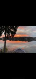 a tent sitting in the middle of a lake at Casa Madre Chic Lakefront Cottage near Ann Arbor in Whitmore Lake