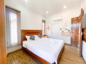 Postel nebo postele na pokoji v ubytování จันทร์มีสุข เชียงคาน + 25 fotografií