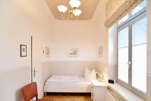 Ein Bett oder Betten in einem Zimmer der Unterkunft Villa Schering App. EG links