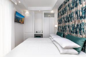 Postel nebo postele na pokoji v ubytování Maison Dorotea