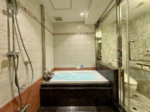 Koupelna v ubytování Hotel Apio + 37 fotografií