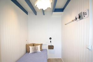 En eller flere senge i et værelse på Le Petit Malo