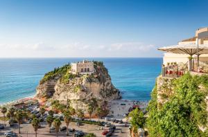 a view of the amalfi coast with a castle at Suite Duomo Tropea in Tropea