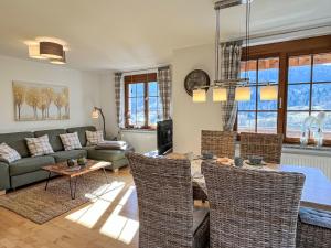 a living room with a couch and a table at Apartment Kleine Auszeit by Interhome in Menzenschwand