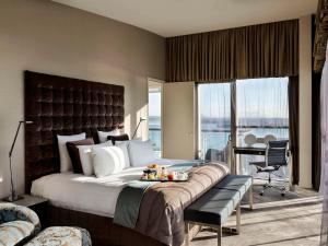 Pullman Auckland Hotel & Apartments客房内的一张或多张床位