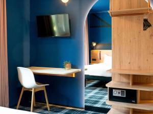 TV a/nebo společenská místnost v ubytování Ibis Styles Colmar Centre