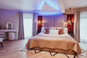 a large bedroom with a large bed and a desk at The Penthouse Luxury Central Apartment in Glossop