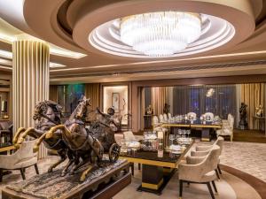 a lobby with a statue of horses on a table at Rixos Premium Seagate in Sharm El Sheikh