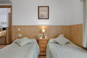 Postel nebo postele na pokoji v ubytování Apartamento Rocio - solo familias