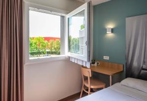 Postel nebo postele na pokoji v ubytování B&B HOTEL Montauban