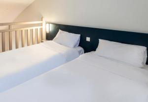 Postel nebo postele na pokoji v ubytování B&B HOTEL Montauban
