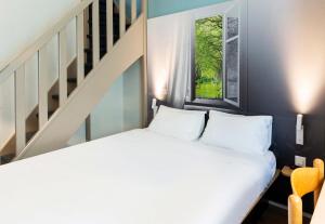 Postel nebo postele na pokoji v ubytování B&B HOTEL Montauban