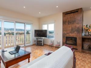 a living room with a couch and a fireplace at Villa Cerro de Mariote by Interhome in Almuñécar
