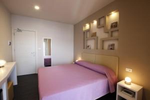 Voodi või voodid majutusasutuse Hotel l'Approdo toas