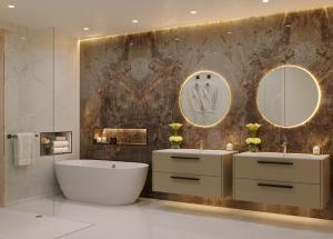a bathroom with two sinks and a tub and mirrors at Solaris Beach House - Beachfront Property, St James in Saint James