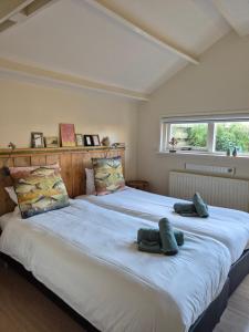 Postel nebo postele na pokoji v ubytování B&B De Wadvaarder