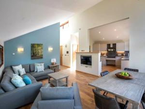 a living room with a couch and a table at Cropton Forest Cabins - Forest Holidays in Cropton