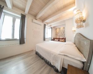 Postel nebo postele na pokoji v ubytování B&B Terra - Stanza Poesia