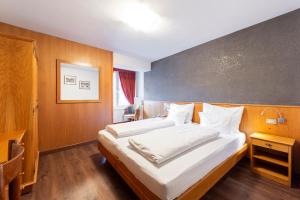 Postel nebo postele na pokoji v ubytování Hotel Stella
