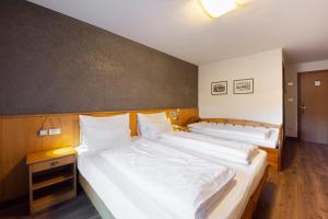 Postel nebo postele na pokoji v ubytování Hotel Stella
