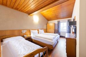 Postel nebo postele na pokoji v ubytování Hotel Stella