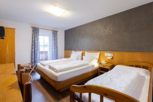 Postel nebo postele na pokoji v ubytování Hotel Stella
