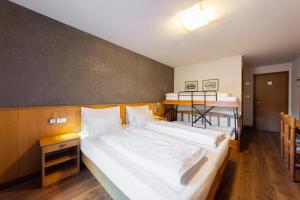 Postel nebo postele na pokoji v ubytování Hotel Stella