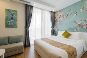 a bedroom with a bed and a couch and a window at Vinhome Green Bay Căn Hộ Chung Cư Cao Cấp in Hanoi +43 photos
