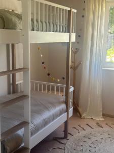 Postel nebo postele na pokoji v ubytování So Magoito Tiny house