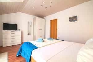 Posteľ alebo postele v izbe v ubytovaní Helvetia Sunny Apartments