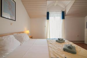 Posteľ alebo postele v izbe v ubytovaní Helvetia Sunny Apartments