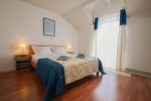 Posteľ alebo postele v izbe v ubytovaní Helvetia Sunny Apartments