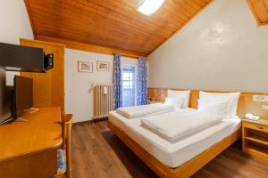 Postel nebo postele na pokoji v ubytování Hotel Stella