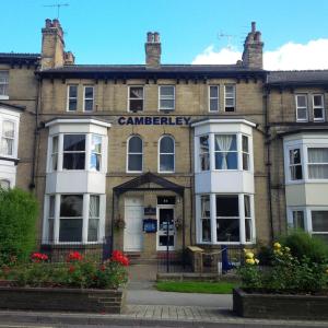 a large brick building with a sign on it at The Camberley in Harrogate