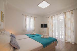 Posteľ alebo postele v izbe v ubytovaní Helvetia Sunny Apartments
