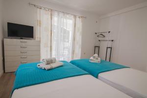 Posteľ alebo postele v izbe v ubytovaní Helvetia Sunny Apartments